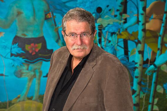 David Beaulieu with a colorful teal mural in the background