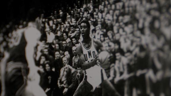 A historic photo of Harry Oden playing basketball for UMD