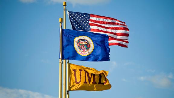 UMD, U.S., and Minnesota flags