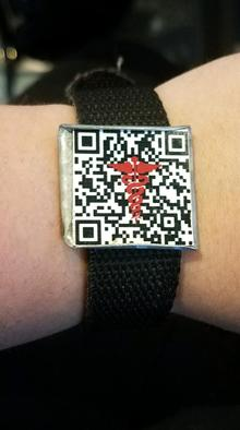 Picture of Katelyn's QR braclet. It has the medical symbol in the center without obstructing the code.