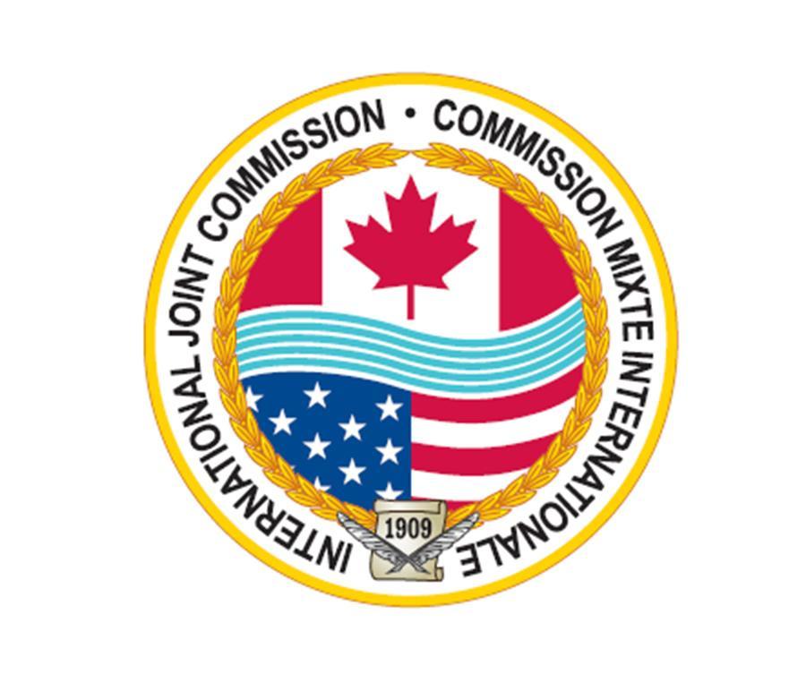 A logo for the International Joint Commission, with a Canadian and American Flag in the center of a circle.