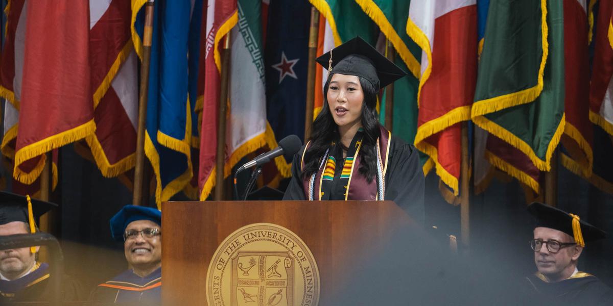Uyen Nguyen, a 2024 UMD grad, speaks to the audience at the 2024 commencement..