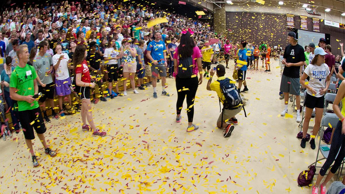 New freshman celebrating with confetti at the new student convocation