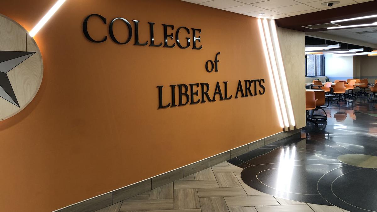 College of Liberal Arts sign on the wall of Cina Hall