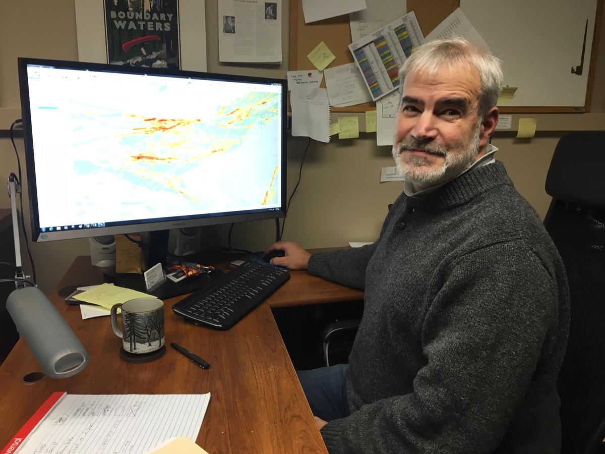 NRRI Senior Geologist Dean Peterson at his computer