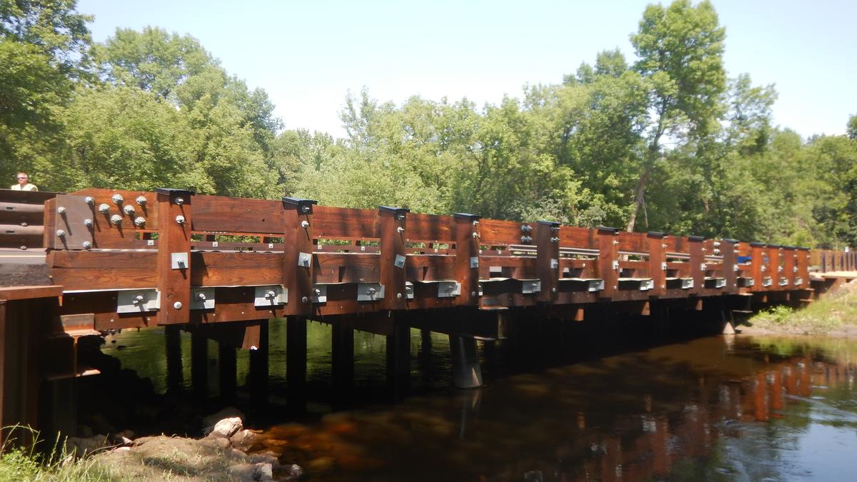 A wooden bridge over a creek