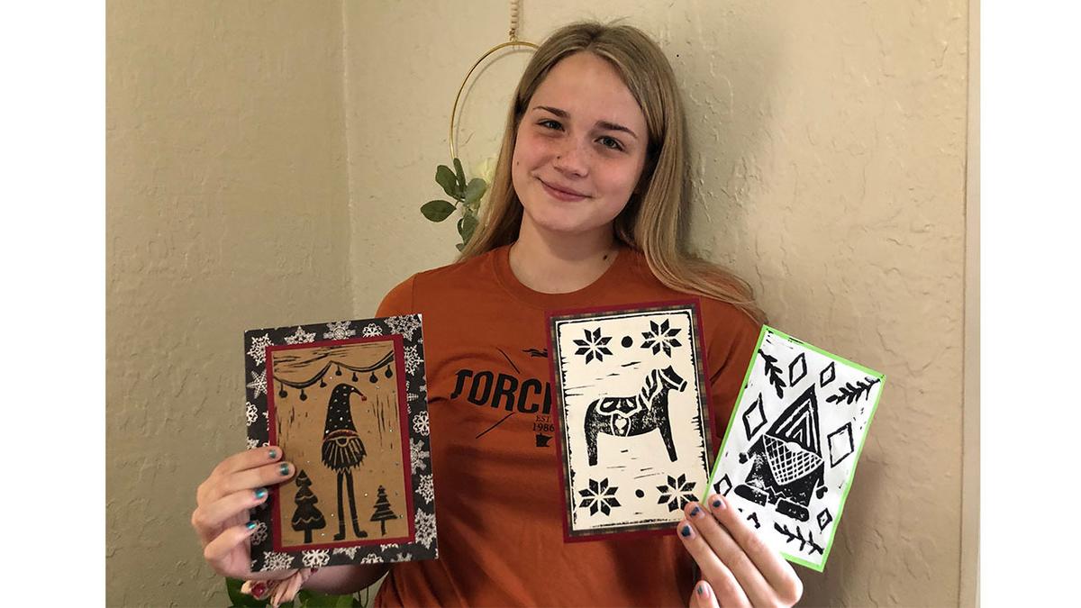 UMD education student Bethany Bogenholm holding handmade cards
