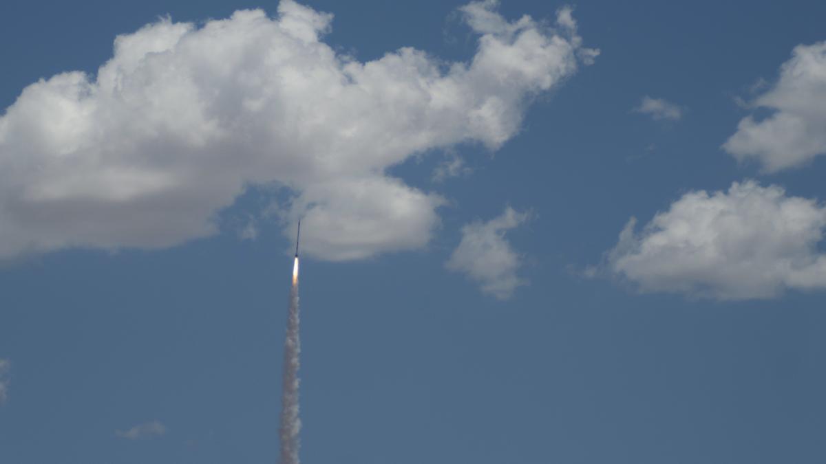 Rocket ascending into the clouds 