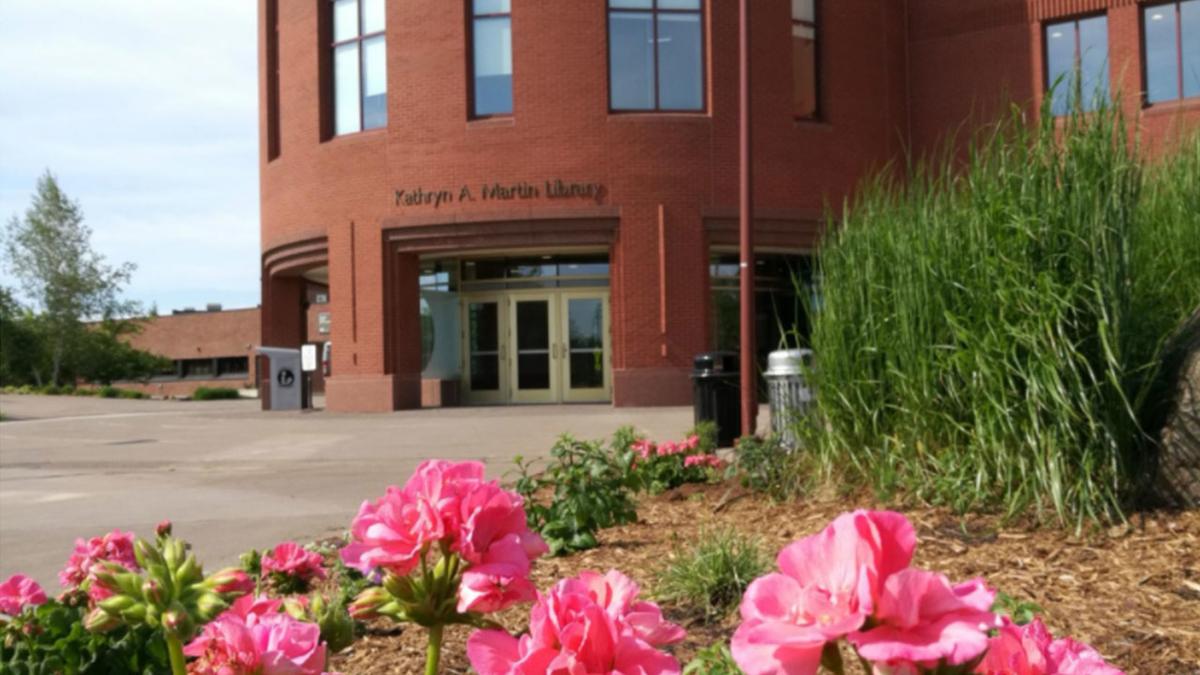 UMD's Kathryn A. Martin Library with pink flowers in foreground
