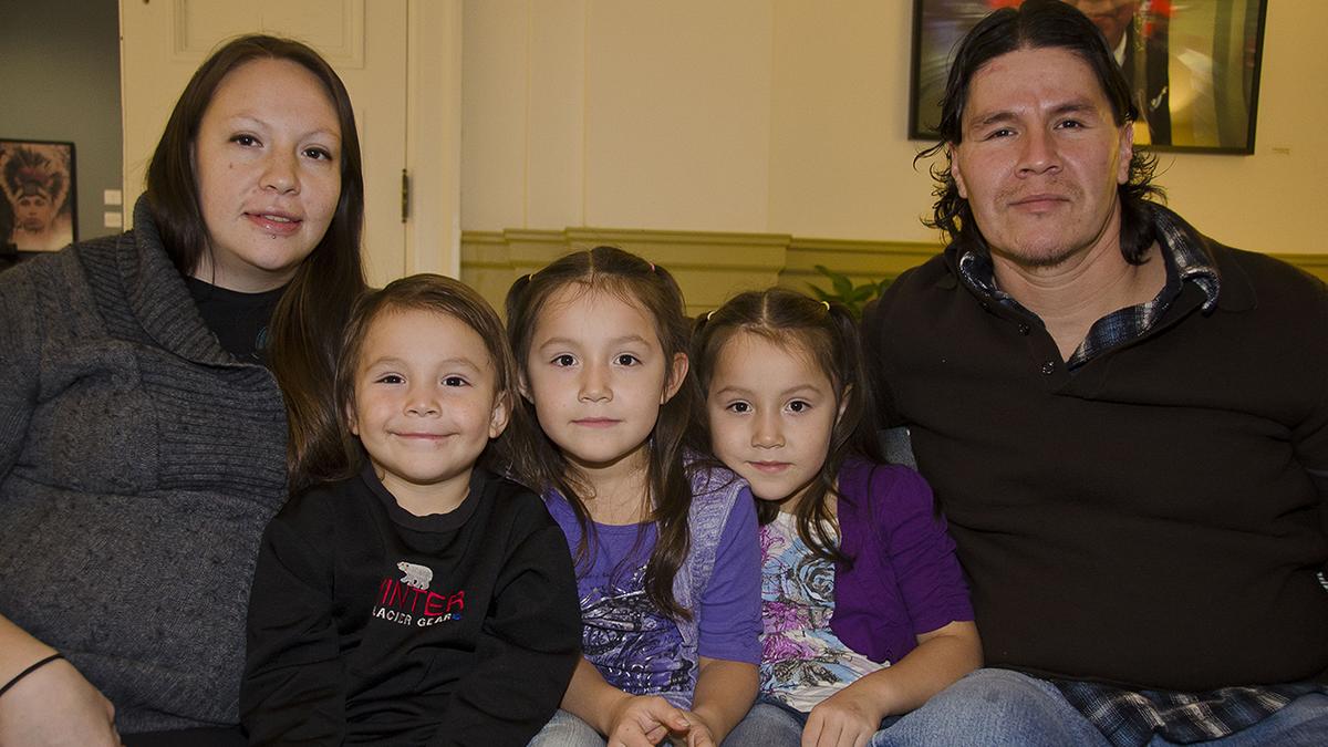 An American Indian man and women with three little girls 