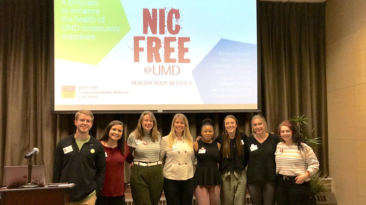 UMD CESHP students standing in front of screen that says "Nic Free at UMD"