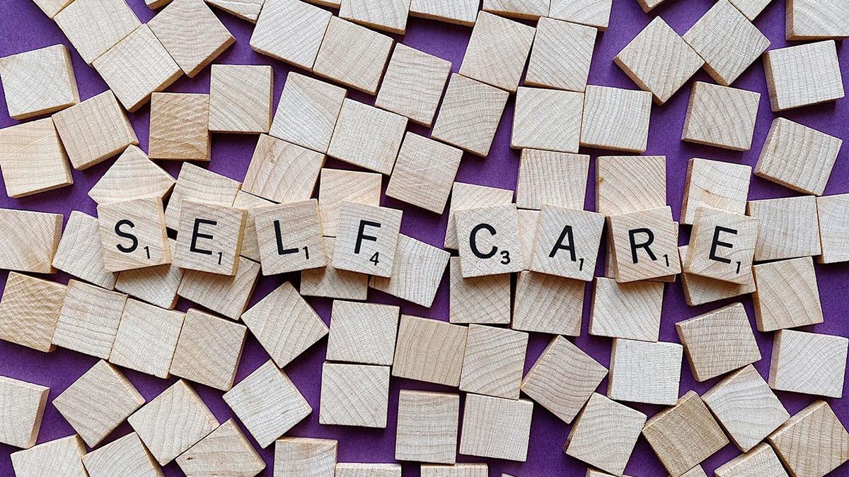 Scrabble titles and the words "Self Care" spelled out