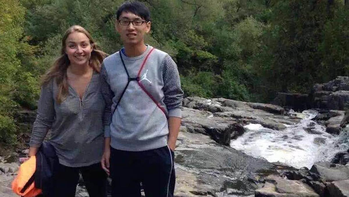 An American student give a Chinese student a tour of Duluth's Chester Park.