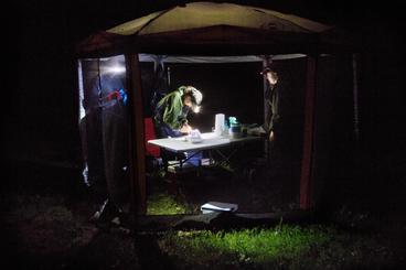 Exterior of NRRI bat researchers' tent at night