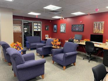 Photo of the AILRC's main space with comfy chairs and computer workstations