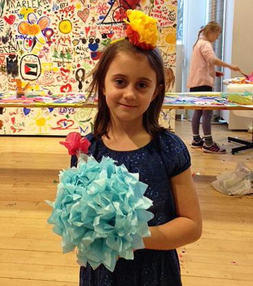 Child holding paper flower