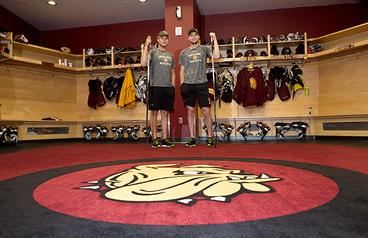 Men's Hockey players Dominic Toninato and Carson Soucy in the Bulldog's locker room