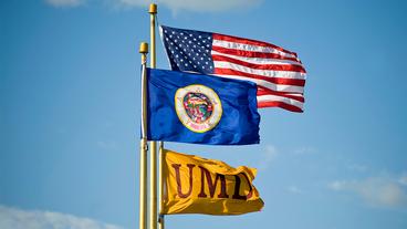 US, Minnesota State, and UMD flags