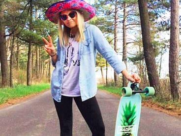 UMD student Megan Shirmers heads to Duluth's paved paths to longboard in Hive Apparel gear. Photo from Hive Apparel Instagram.