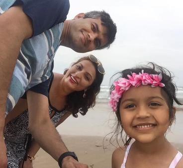 Prabhat, Sharmila, and Arya on a beach adventure.