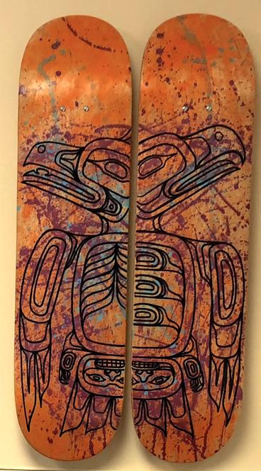 In the office of Dr. Mary Owen, the image of Tlingit eagles are carved on two wooden snowboards.