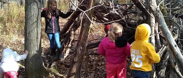 Children at the fort they built at Stowe Elementary school