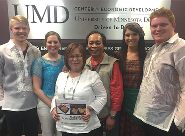Beth's Famous Egg Rolls and Empanadas also participated in the Marketing SBI. This group of students wore Filipino clothing for their presentation.