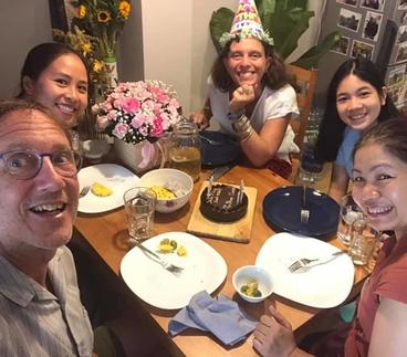 A birthday party with Lan Zoukactera, a faculty member at the University, Heather-Marie, Dang Thuy An and Đoàn Khuyên.