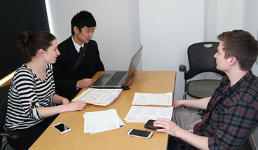 Mary Pruitt and Jesse Pai work with a client in LSBE.
