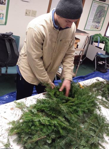 Trevor Struve practices his wreath making skills.