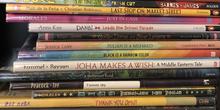 A stack of picture books, with titles about diversity and inclusion.