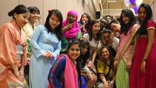 Students posing for picture at previous Feast of Nations