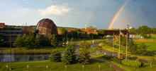 Aerial view of campus that includes a double rainbow near the planetarium