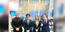 One of the LSBE teams in front of the Financial Markets Lab