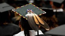 Back of mortar board with a feather and bead work.